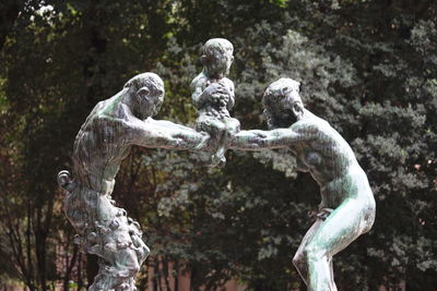 Close-up of statue against trees