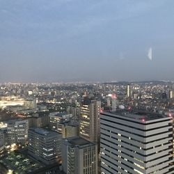High angle view of buildings in city against sky