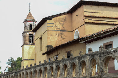 Low angle view of old catholic church