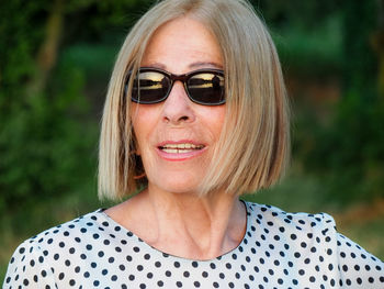 Portrait of young woman wearing sunglasses