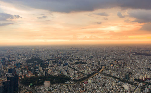 High angle view of city buildings during sunset