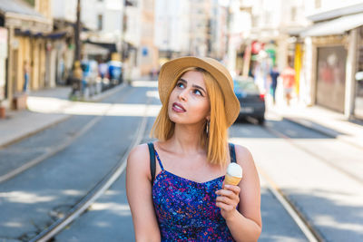 Portrait of beautiful young woman in hat