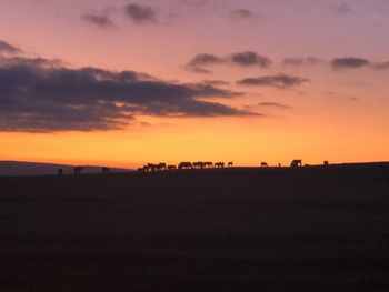 Scenic view of silhouette landscape against sky during sunset