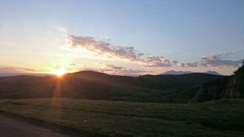 Scenic view of landscape against sky during sunset