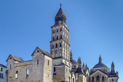 Low angle view of building against blue sky