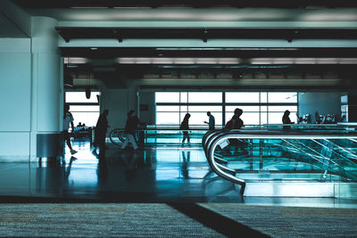 People walking at airport terminal