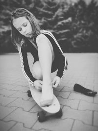 Portrait of woman sitting outdoors
