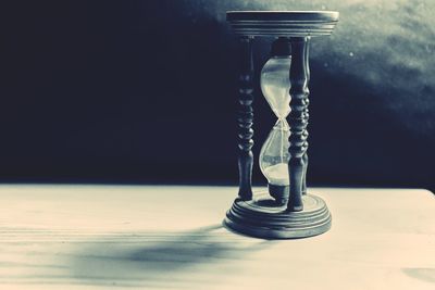 Close-up of hourglass on table