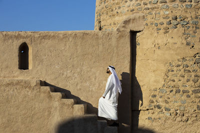 View of cross on wall against building