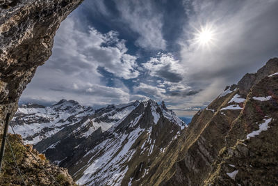 Scenic view of mountains against sky during winter