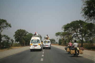 People on road against clear sky