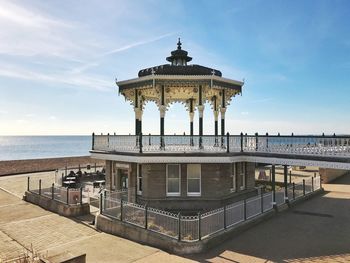 Gazebo on shore against sky at brighton