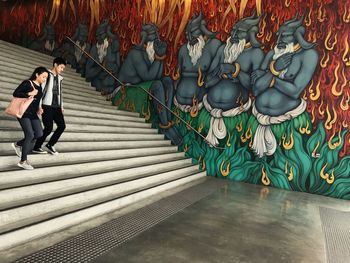 Full length of people standing in corridor