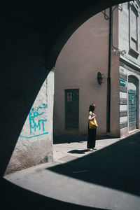 Rear view of woman standing in city