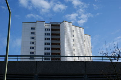 Low angle view of building against cloudy sky