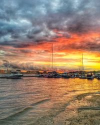 Scenic view of calm sea against cloudy sky