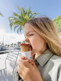 Young woman holding ice cream