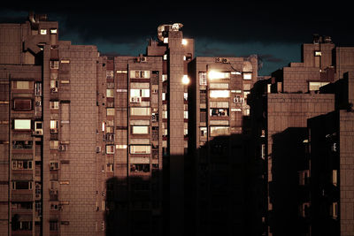 Buildings in city at night