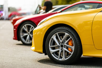 Close-up of car on road