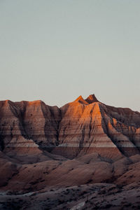 Rock formations in desert against clear sky