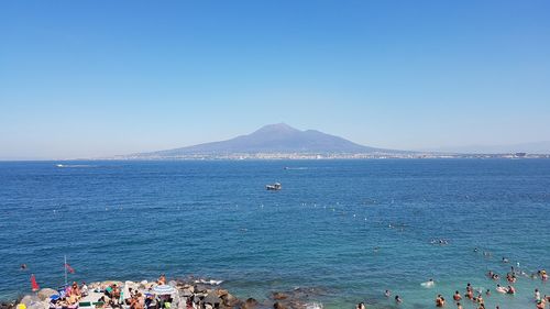 Scenic view of sea against clear blue sky