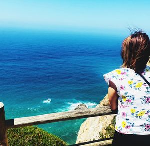 Rear view of woman looking at sea