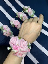 Midsection of woman holding pink flower bouquet