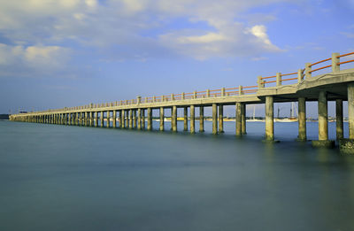 Pier over sea against sky