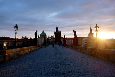 Panoramic view of city street and buildings at sunrise