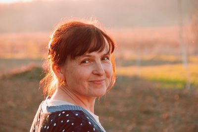 Portrait of smiling woman in field