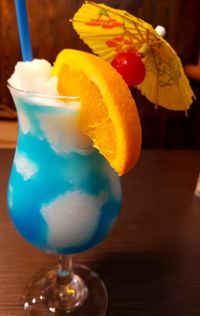Close-up of cocktail in glass on table