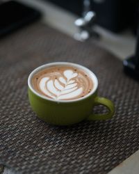 Close-up of cappuccino on table