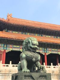 Statue of historic building against clear sky