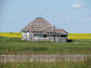 House on field against sky