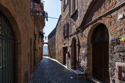 Narrow alley amidst old buildings in town