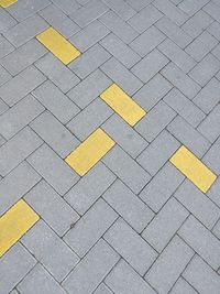 High angle view of arrow sign on road