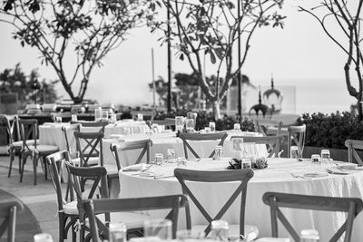 Empty chairs and tables at restaurant