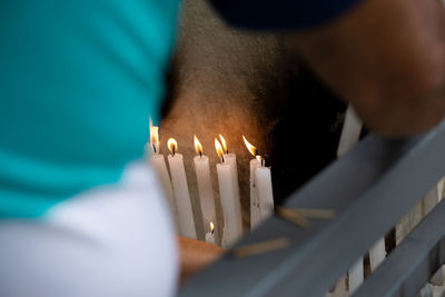 Candles lit on the day of the dead, at the campo santo cemetery in the city of salvador, bahia.