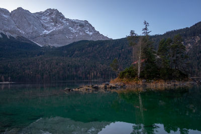 Scenic view of lake and mountains against sky