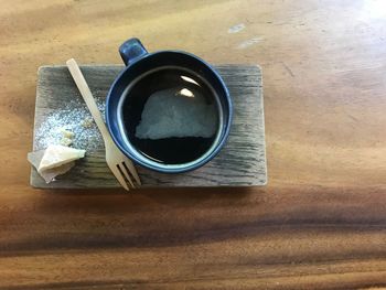 High angle view of black coffee on table