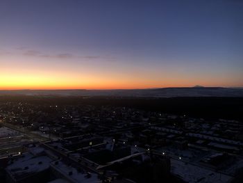 High angle view of buildings against sky during sunset