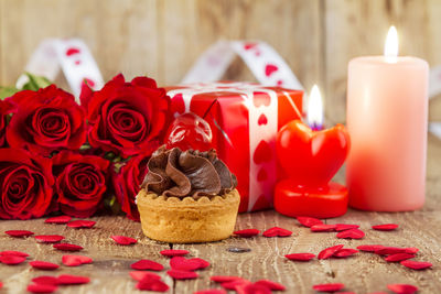 Close-up of red roses on table