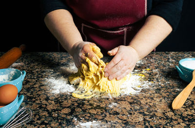 Midsection of woman preparing food