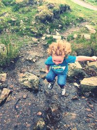 Full length of boy standing in park