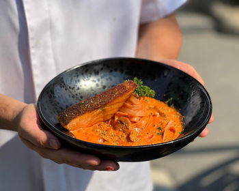 Midsection of man preparing food