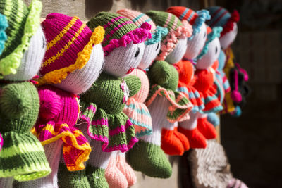 Colorful handmade knitted dolls at different colors