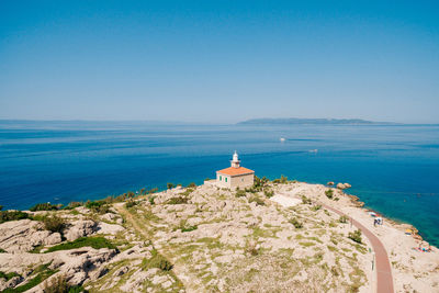 Scenic view of sea against clear blue sky