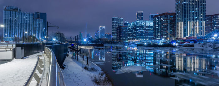 Boats moored at harbor