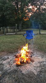 Bonfire on field against sky