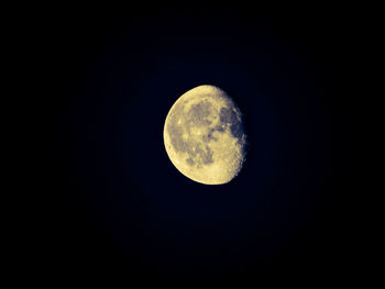 Low angle view of moon against clear sky at night